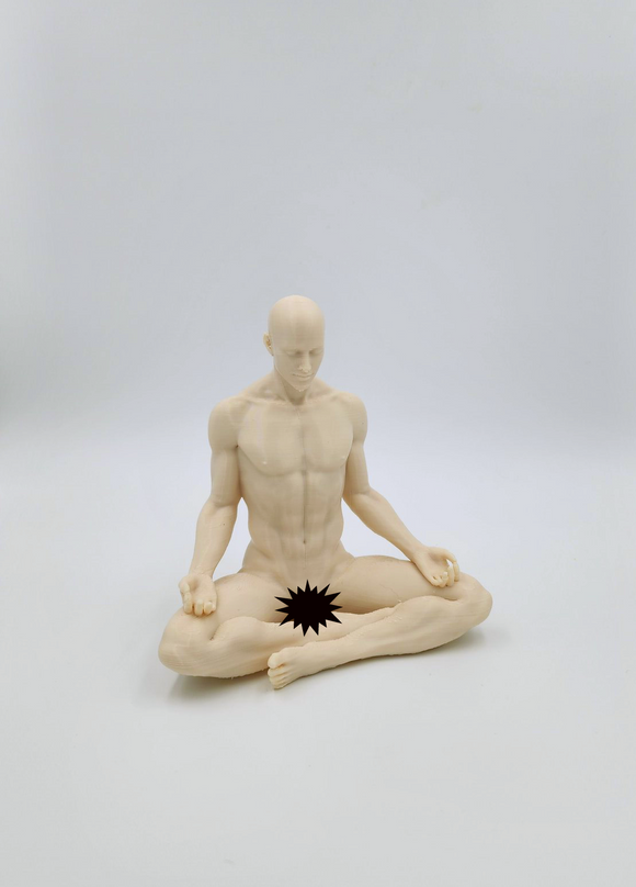 a statue of a man sitting in the middle of a yoga pose