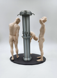 a couple of figurines standing on top of a table