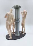 a couple of nude figurines standing next to a pole